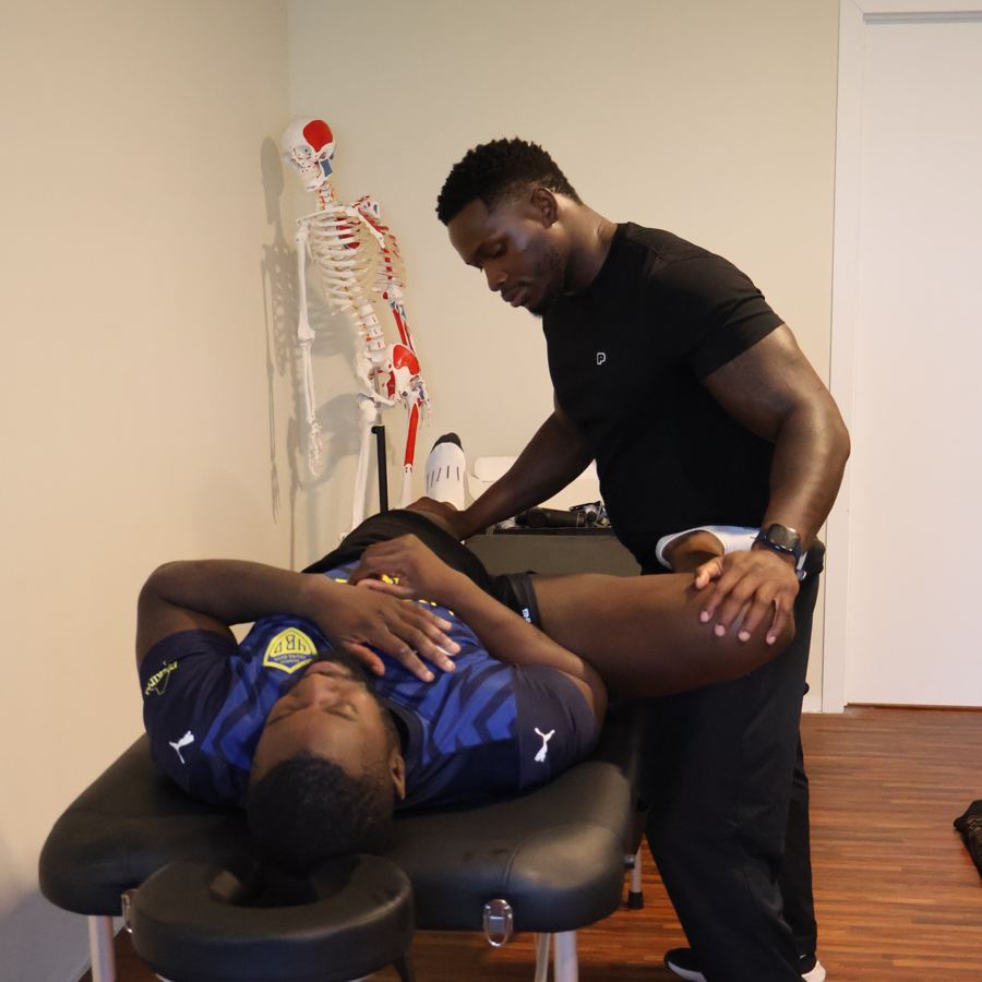 Assisted hip stretch on the table
