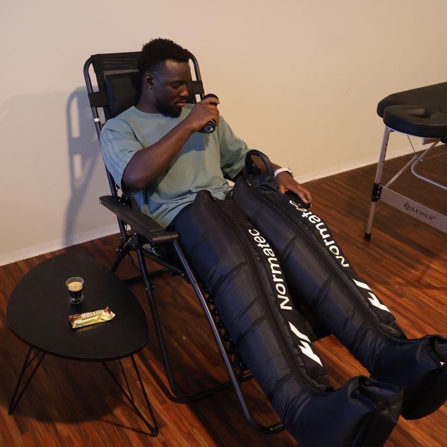 Athlete relaxing in compression boots